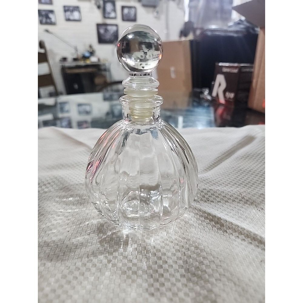 This little Blown glass decanter shaped bottle is a perfume refill bottle. It is